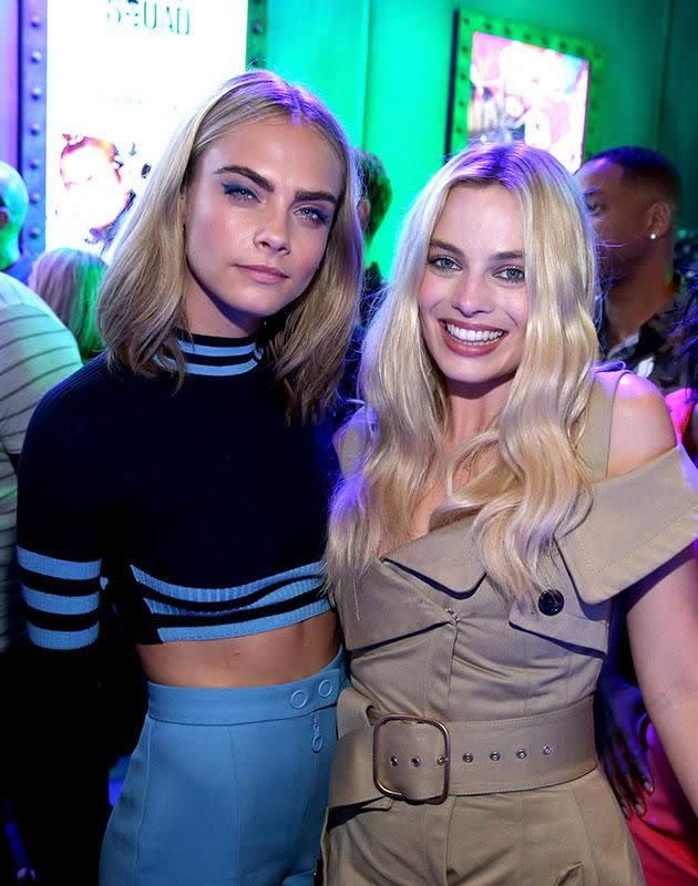 Cara Delevingne and Margot Robbie hanging out in-between Suicide Squad promo duties. Source: Getty