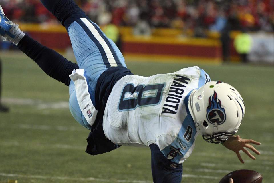 Tennessee Titans quarterback Marcus Mariota (8) leaps over the goal line for a touchdown against the Chiefs. (AP)