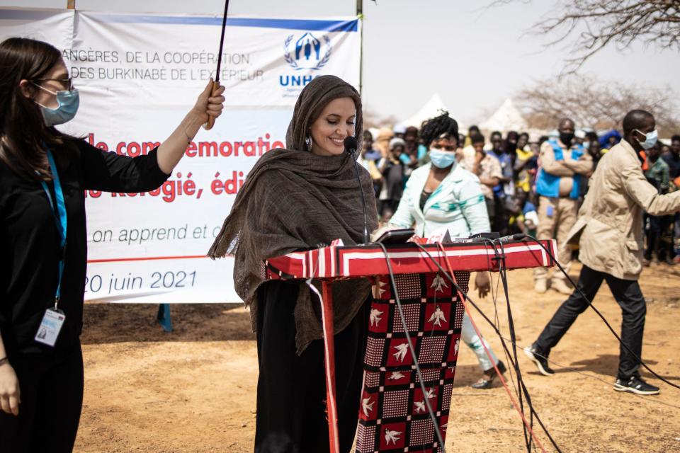 Actress Angelina Jolie, special envoy for the United Nations High Commissioner for Refugees, gives a statement in Goudebou, a Malian refugee camp in northern Burkina Faso, on International Refugee Day on June 20, 2021.  / Credit: OLYMPIA DE MAISMONT/AFP via Getty Images