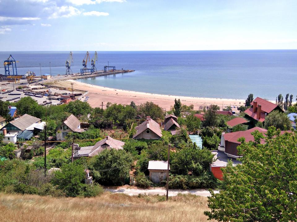 Ukraine. Mariupol. View of the coast of the Azov Sea, the village, and the seaport.