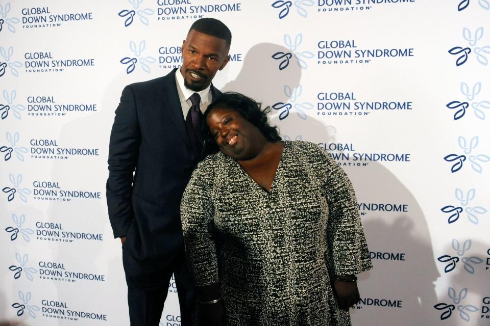 Actor Jamie Foxx poses for pictures with his sister DeOndra Dixon on November 12, 2016. / Credit: JASON CONNOLLY/AFP via Getty Images