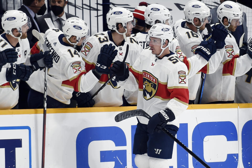 Florida Panthers center Noel Acciari (55) is congratulated after scoring a goal against the Nashville Predators during the second period of an NHL hockey game Saturday, March 6, 2021, in Nashville, Tenn. (AP Photo/Mark Zaleski)