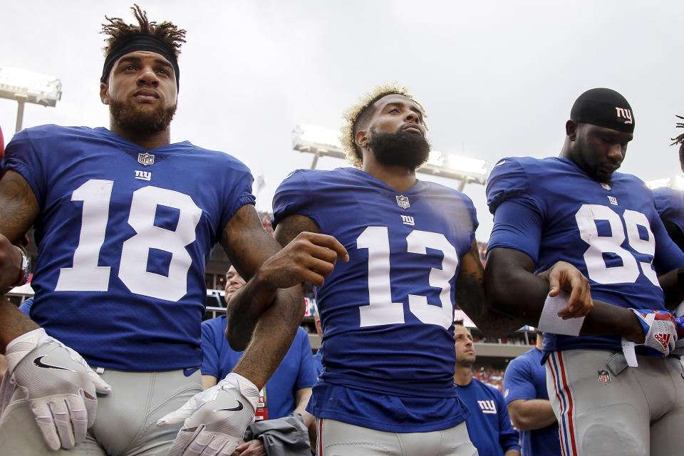 <p>Wide Receivers Roger Lewis, Jr. #18, Odell Beckham, Jr. #13 and Tight End Jerell Adams #89 of the New York Giants lock arms during the National Anthem befoe the game against the Tampa Bay Buccaneers at Raymond James Stadium on October 1, 2017 in Tampa, Florida. (Photo by Don Juan Moore/Getty Images) </p>