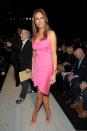 <p>Sitting front row at a Michael Kors show, Melania grabbed attention in a bright pink sheath dress and nude stilettos. <i>[Photo: Getty]</i> </p>