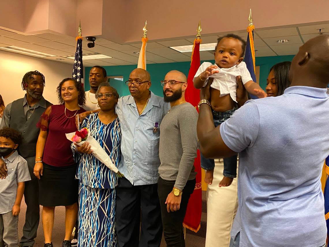 Vietnam War veteran Alvin Alce, 72, pictured in the center with his wife, Dehavalyna Alce, poses with his family on Aug. 8, 2022.