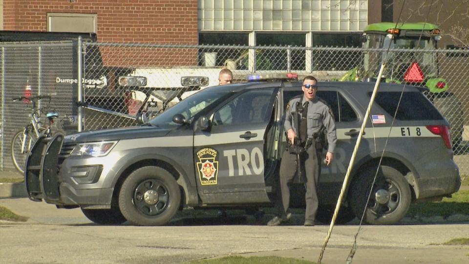 A Pennsylvania State Police Trooper at the scene of a shooting at Erie High School. (WICU)