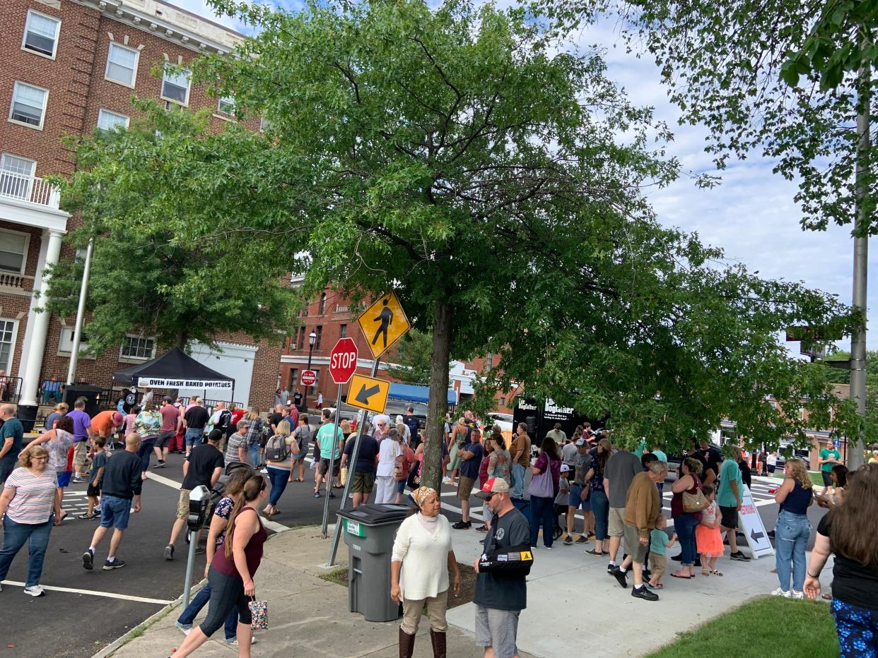 A crowd gathers at the Get Baked Potato Company truck at the 4th annual Food Truck Festival in Gardner on July 10, 2021.