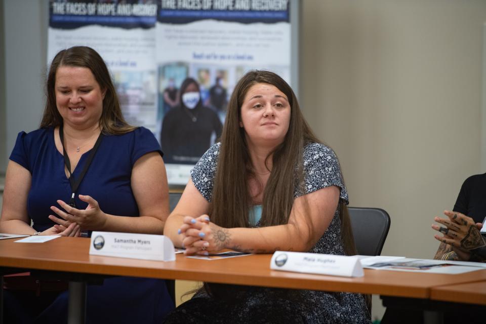 Samantha Myers, MAT program participant, speaks at a meeting with North Carolina Attorney General Josh Stein and members of other Buncombe County agencies on July 25, 2022.