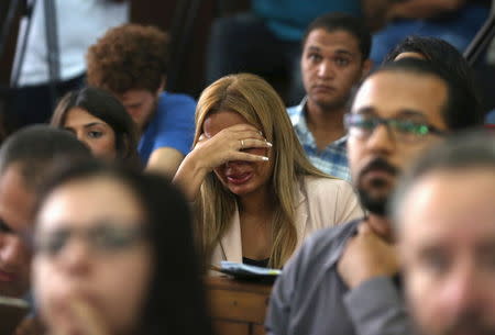 Marwa Omara, wife of Al Jazeera television journalist Mohamed Fahmy, reacts after hearing the verdict at a court in Cairo, Egypt, August 29, 2015. REUTERS/Asmaa Waguih