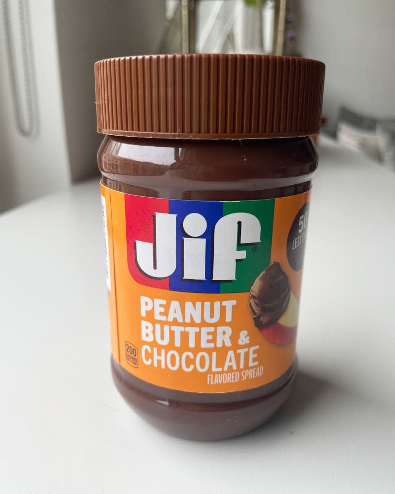 Jif peanut butter and chocolate spread in container.