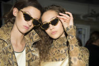 <p>Models show off their cool retro sunglasses backstage at Topshop. <em>[Photo: Topshop]</em> </p>