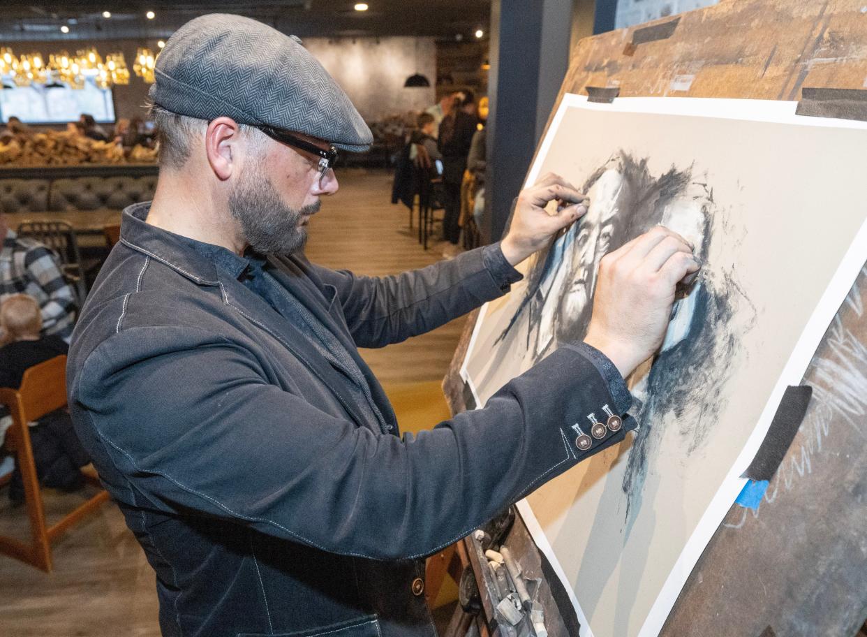 Bruce Budd, director of operations at The Nook restaurant in the Massillon area, is also an artist. Budd creates live art while people eat.