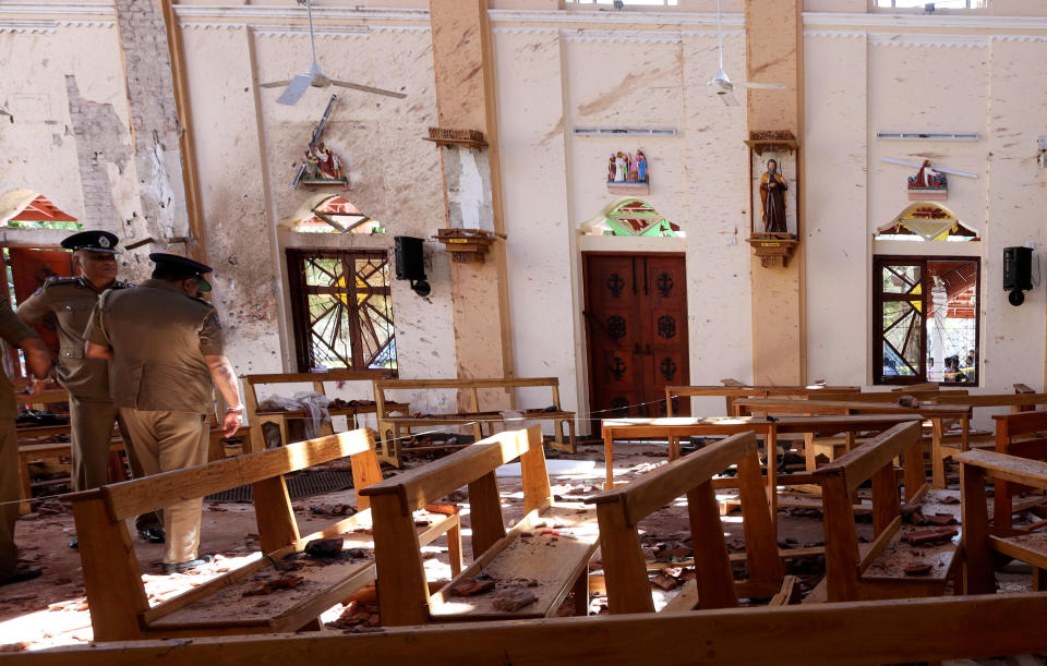 Police officers work at the scene at St. Sebastian Catholic Church, after bomb blasts ripped through churches and luxury hotels on Easter, in Negombo, Sri Lanka April 22, 2019. (Photo: Athit Perawongmetha/Reuters)