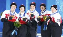 Gold medallists Canada's Brad Jacobs, Ryan Fry, E.J. Harnden, Ryan Harnden and Caleb Flaxey (L-R) celebrate during the victory ceremony for the men's curling event at the 2014 Sochi Winter Olympics in Sochi, February 22, 2104. REUTERS/Shamil Zhumatov (RUSSIA - Tags: SPORT CURLING OLYMPICS)