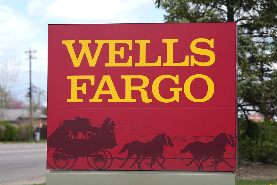 FILE - A sign stands outside a branch of Wells Fargo bank on April 17, 2024, in Littleton, Colo. Wells Fargo reports earnings on Friday, July 12, 2024. (AP Photo/David Zalubowski, File)