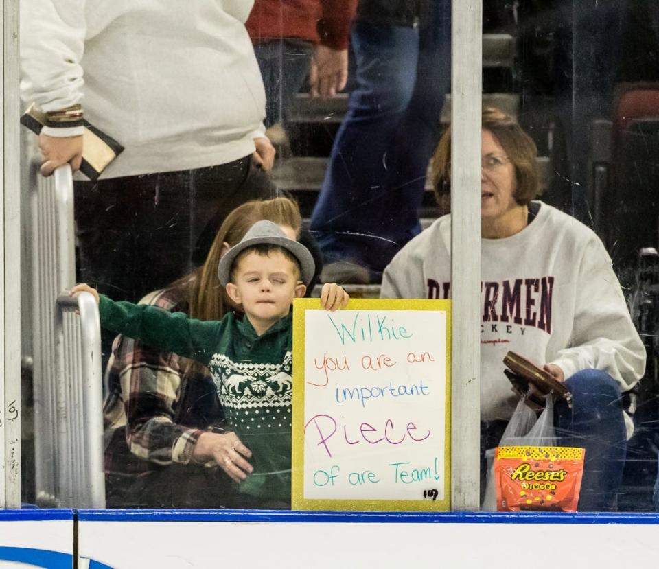 A young Rivermen fan has some candy and a message to share with defenseman Zach Wilkie while watching him help Peoria to a 5-3 victory over Huntsville at Carver Arena on Saturday, Dec. 10, 2022.