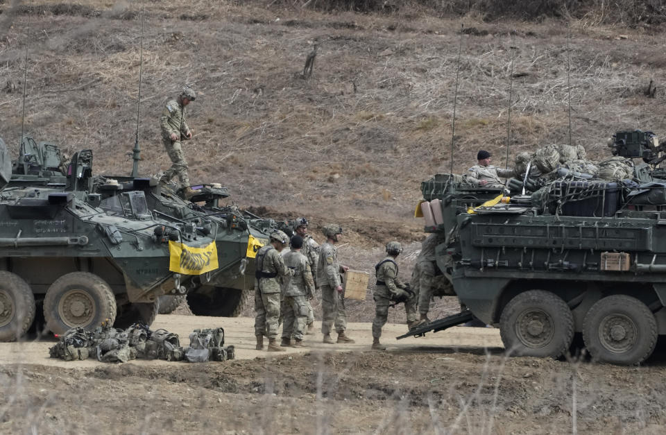 U.S. Army soldiers prepare for their exercise at a training field in Paju, South Korea, near the border with North Korea, Friday, March 17, 2023. North Korea said Friday it fired an intercontinental ballistic missile to "strike fear into the enemies" as South Korea and Japan agreed at a summit to work closely on regional security with the United States and staged military exercises around the region.(AP Photo/Ahn Young-joon)