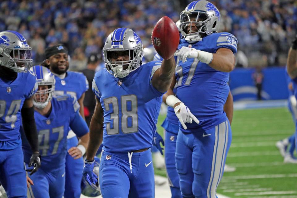 Lions safety C.J. Moore celebrates after running back a fake punt against the Vikings during the second half of the Lions' 34-23 win over the Vikings on Sunday, Dec. 11, 2022, at Ford Field.