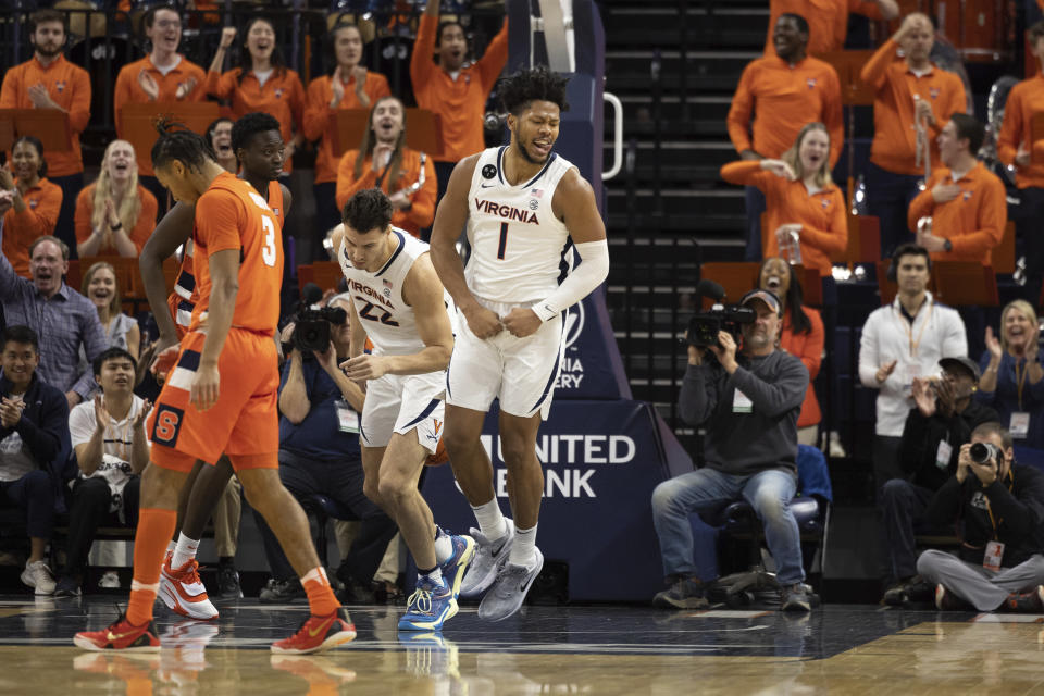 Virginia's Jayden Gardner (1) celebrates during the first half of an NCAA college basketball game against Syracuse in Charlottesville, Va., Saturday, Jan. 7, 2023. (AP Photo/Mike Kropf)