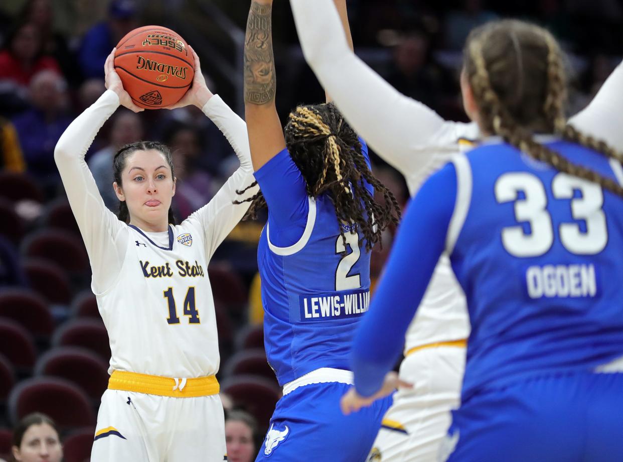 Kent State Golden Flashes guard Katie Shumate (14) looks to pass during the first halfx of the Mid-American Conference Tournament womenÕs championship game at Rocket Mortgage FieldHouse, Saturday, March 16, 2024, in Cleveland, Ohio.