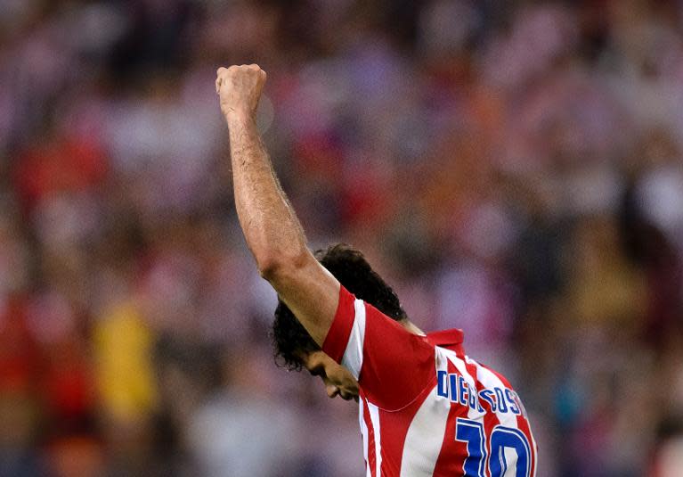 Atletico Madrid's forward Diego Costa celebrates after scoring during a Spanish league football match against Elche at the Vicente Calderon stadium in Madrid on April 18, 2014