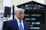 FILE - In this Monday, June 1, 2020 file photo, President Donald Trump holds a Bible as he visits outside St. John's Church across Lafayette Park from the White House in Washington. Part of the church was set on fire during protests the previous night. (AP Photo/Patrick Semansky)