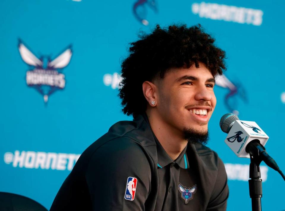 Charlotte Hornets guard LaMelo Ball smiles as he is asked whether he is going to let rookie Brandon Miller drive one of his cars during a press conference discussing Ball’s five-year $260 million extension with the team on Wednesday, July 19, 2023 at Spectrum Center in Charlotte, NC.
