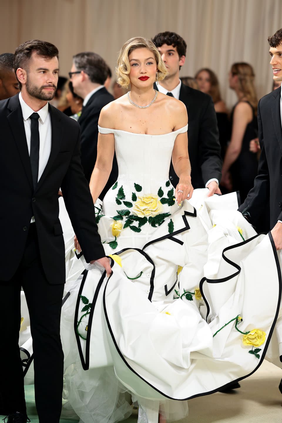 Gigi Hadid Goes Retro in a Floral White Tiered Dress at the 2024 Met Gala