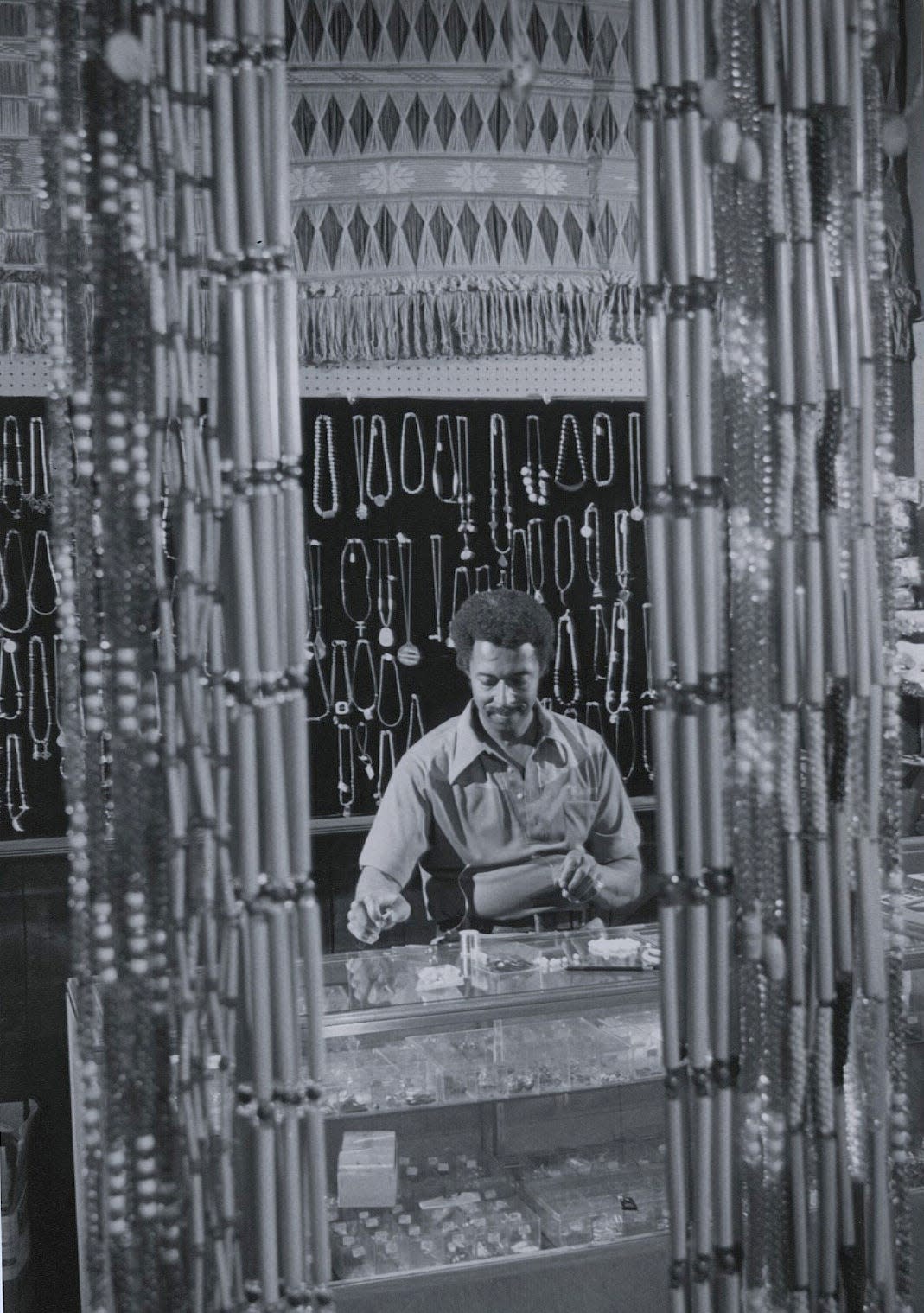 Willie Munson is seen at work in Betty's Bead Bank in 1983.