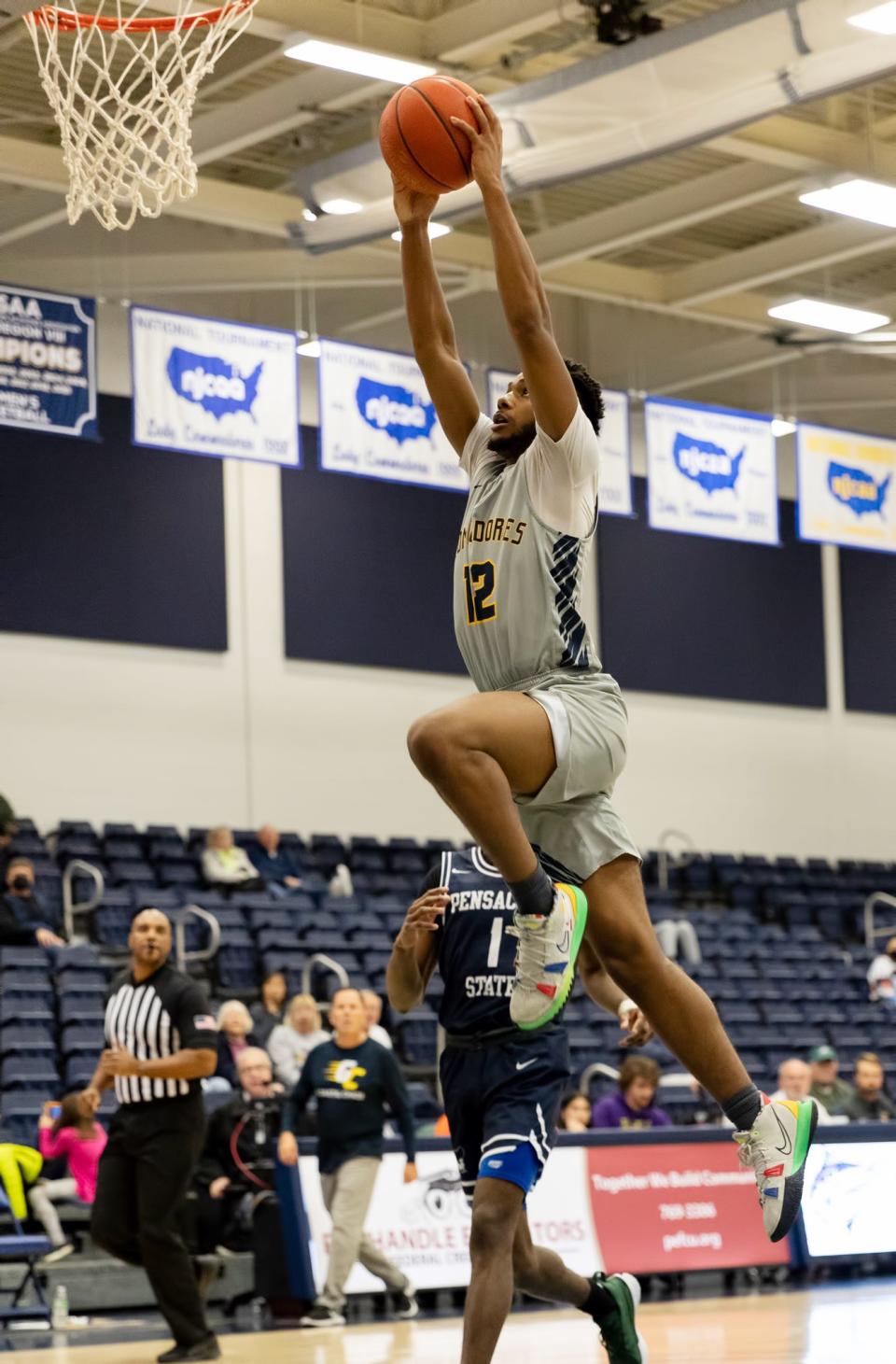 Tauris Watson glides in for a dunk in the second half of a Panhandle Conference game at the Billy Harrison Field House on Saturday, Jan. 22, 2022.