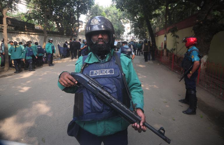 Bangladeshi police stand guard in front of the house of main opposition Bangladesh Nationalist Party leader Khaleda Zia in Dhaka on December 29, 2013