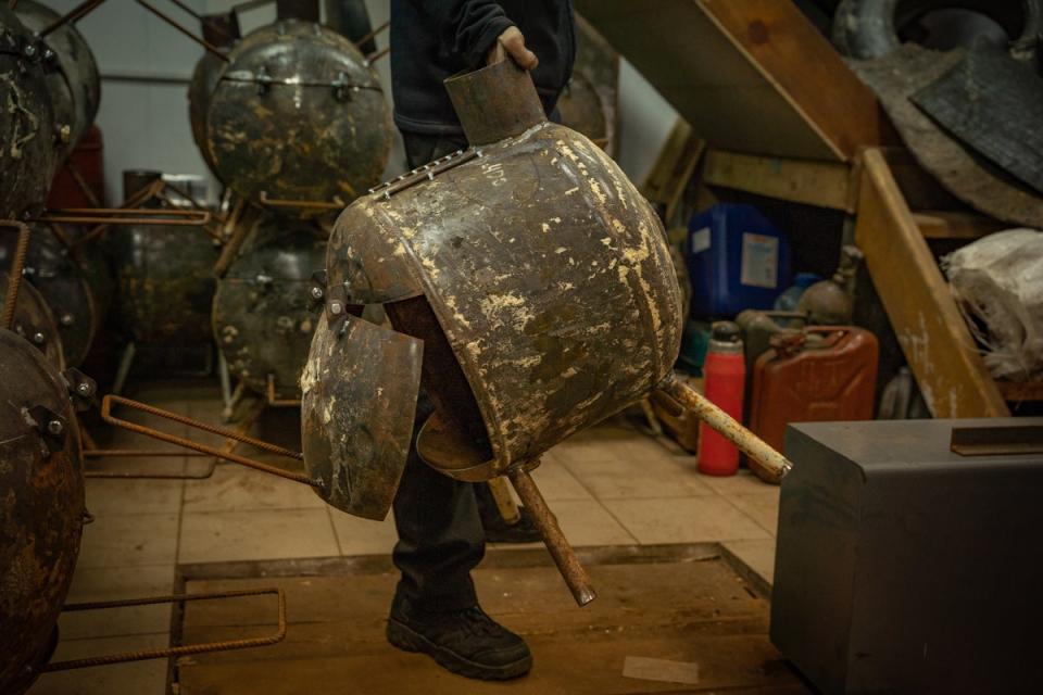 Made of a discarded water heater and scrap metal this pot-belly stove is designed to help Ukrainians this winter (Bel Trew)