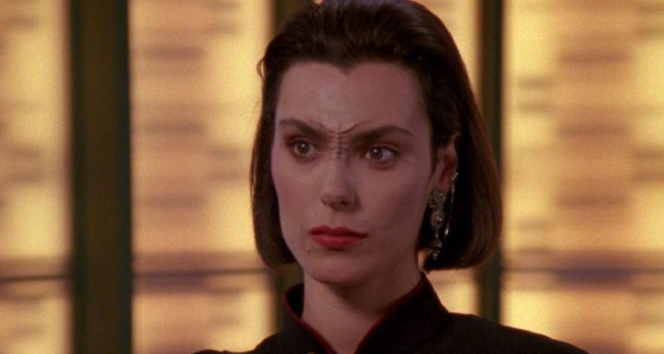 Michelle Forbes as Ensign Ro Laren, a recurring crew member in Star Trek: The Next Generation.