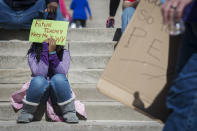 <p>Destiny Carpenter holds a sign outside of the Capitol building on the fourth day of statewide walkouts in Charleston, W.Va., on Tuesday, Feb. 27, 2018. (Photo: Craig Hudson/Charleston Gazette-Mail via AP) </p>