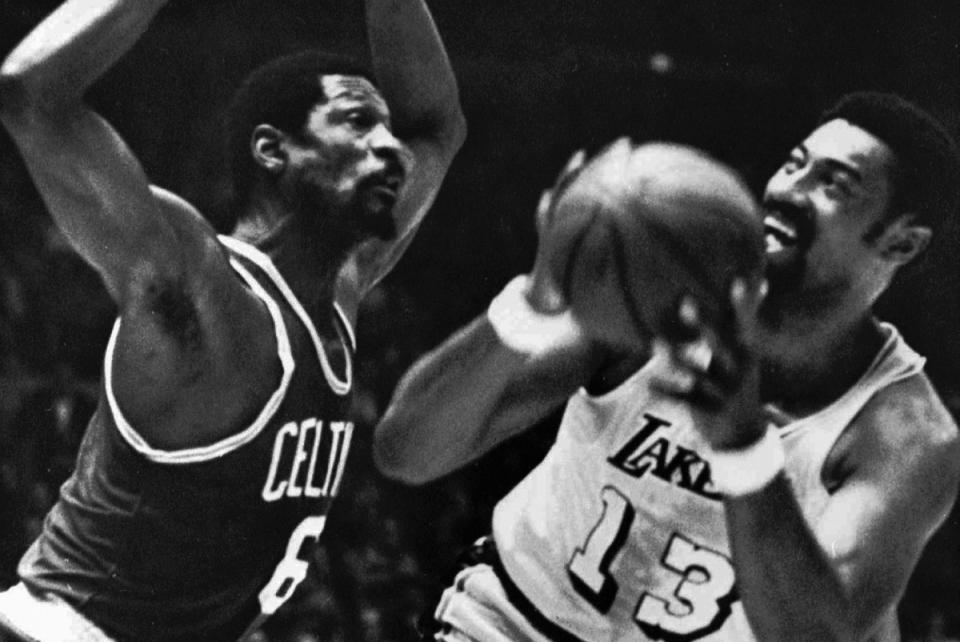 In this May 5, 1969, file photo, <a class="link " href="https://sports.yahoo.com/nba/teams/la-lakers/" data-i13n="sec:content-canvas;subsec:anchor_text;elm:context_link" data-ylk="slk:Los Angeles Lakers;sec:content-canvas;subsec:anchor_text;elm:context_link;itc:0">Los Angeles Lakers</a>’ Wilt Chamberlain tries to shoot against Boston Celtics’ Bill Russell during an NBA basketball finals game at the Forum in Los Angeles. The Celtics and the Lakers met 10 times in the finals from 1959-87, with the Celtics winning the first eight. From 1983-87 alone, they played nearly 30 games, counting playoffs. AP Photo/File