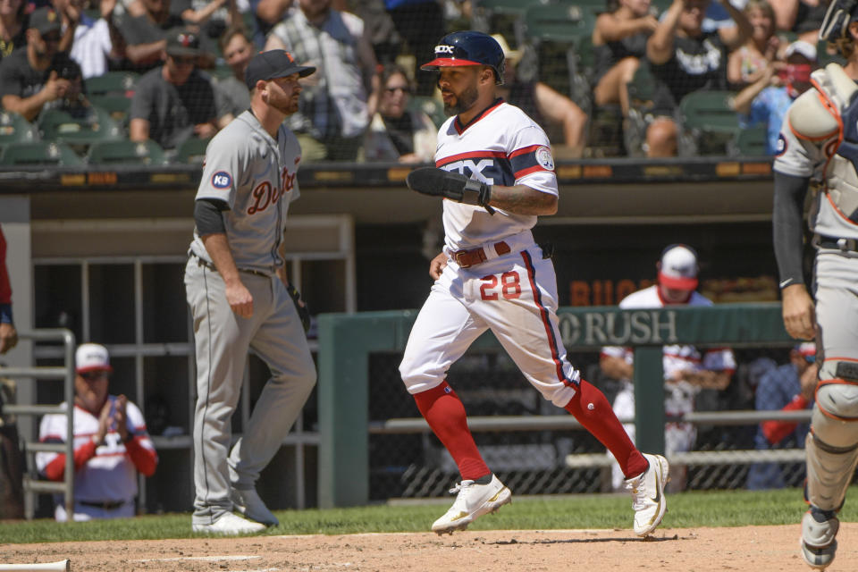 Chicago White Sox Leury Garcia (28) scores on a single by Yoan Moncada against the Detroit Tigers during the fifth inning of a baseball game, Sunday, July 10, 2022, in Chicago. (AP Photo/Mark Black)