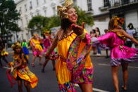 Performers dance during the children's parade at the Notting Hill Carnival in London, Sunday Aug. 28, 2022. The Carnival returned to the streets for the first time in two years, after it was thwarted by the pandemic. (Victoria Jones/PA via AP)