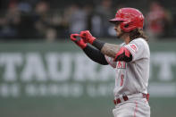 Cincinnati Reds' Jonathan India gestures to the dugout after hitting an RBI-double during the second inning of a baseball game against the Milwaukee Brewers, Monday, June 14, 2021, in Milwaukee. (AP Photo/Aaron Gash)