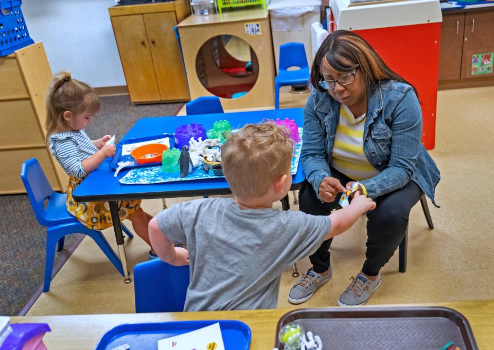 Gina Armstrong, curriculum co-chair at Carmel Clay Edu-Care, helps kids as they make art Thursday, May 18, 2023 at Clay Middle School.  The district offers childcare for its employees.