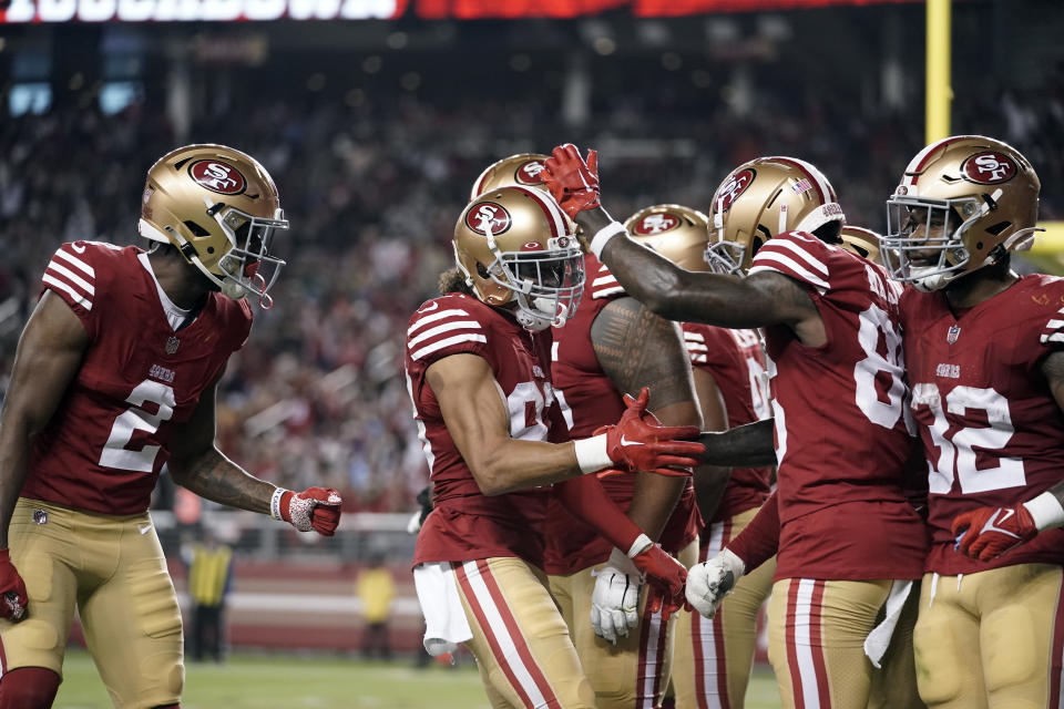 San Francisco 49ers wide receiver Willie Snead IV, center, celebrates his touchdown with teammates during the second half of a preseason NFL football game against the Los Angeles Chargers Friday, Aug. 25, 2023, in Santa Clara, Calif. (AP Photo/Godofredo A. Vásquez)