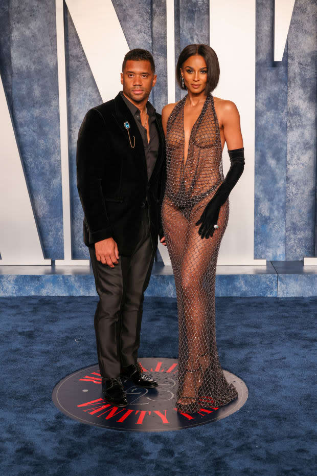 BEVERLY HILLS, CALIFORNIA - MARCH 12: (EDITORS NOTE: Image contains nudity.) (L-R) Russell Wilson and Ciara attend the 2023 Vanity Fair Oscar Party Hosted By Radhika Jones at Wallis Annenberg Center for the Performing Arts on March 12, 2023 in Beverly Hills, California. (Photo by John Shearer/WireImage)<p><a href="https://www.gettyimages.com/detail/1473157466" rel="nofollow noopener" target="_blank" data-ylk="slk:John Shearer/Getty Images;elm:context_link;itc:0;sec:content-canvas" class="link ">John Shearer/Getty Images</a></p>