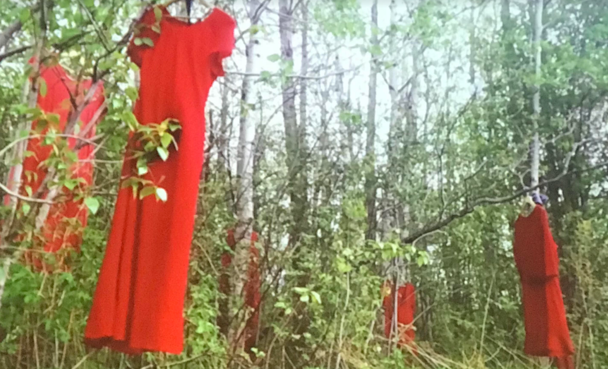 The red dresses hanging from trees represent the missing and murdered Indigenous women that are often forgotten. Photo taken on the Sault Ste. Marie of Chippewa Indians Reservation in Sault Ste. Marie, Mich. (Photo/Native News Online)