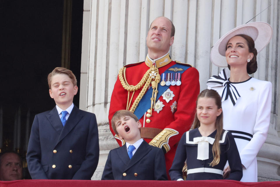 LONDON, ENGLAND - JUNE 15: Prince George of Wales, Prince William, Prince of Wales, Prince Louis of Wales, Princess Charlotte of Wales and Catherine, Princess of Wales on the balcony of Buckingham Palace during Trooping the Colour on June 15, 2024 in London, England. Trooping the Colour is a ceremonial parade celebrating the official birthday of the British Monarch. The event features over 1,400 soldiers and officers, accompanied by 200 horses. More than 400 musicians from ten different bands and Corps of Drums march and perform in perfect harmony. (Photo by Neil Mockford/GC Images)