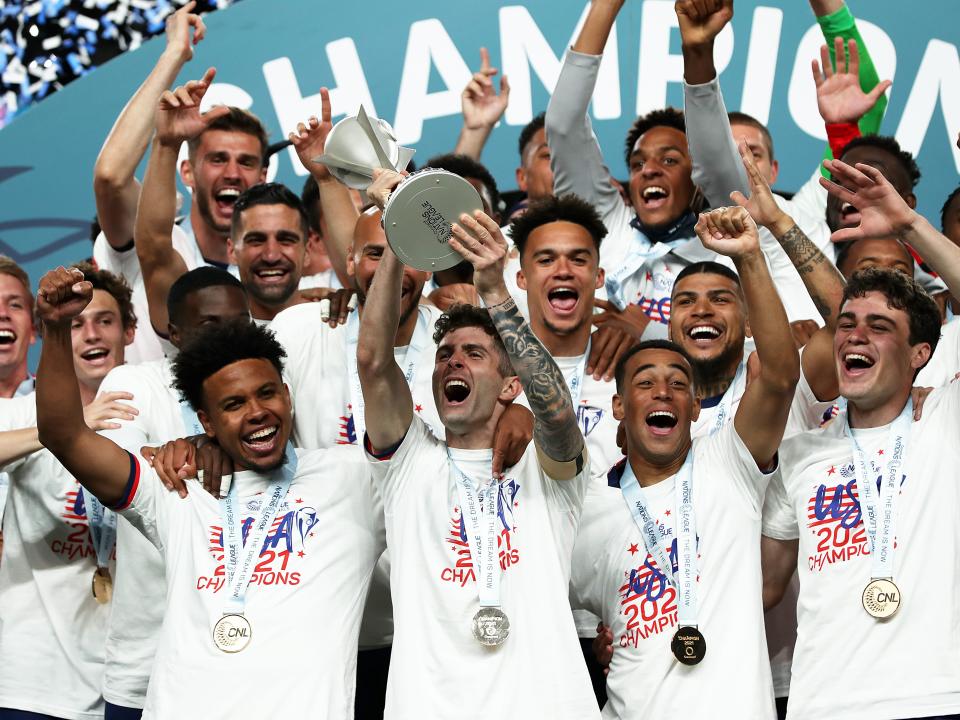 Captain Christian Pulisic #10 of United States lift the trophy after winning the CONCACAF Nations League Championship Final between United States and Mexico at Empower Field At Mile High on June 6, 2021 in Denver, Colorado.