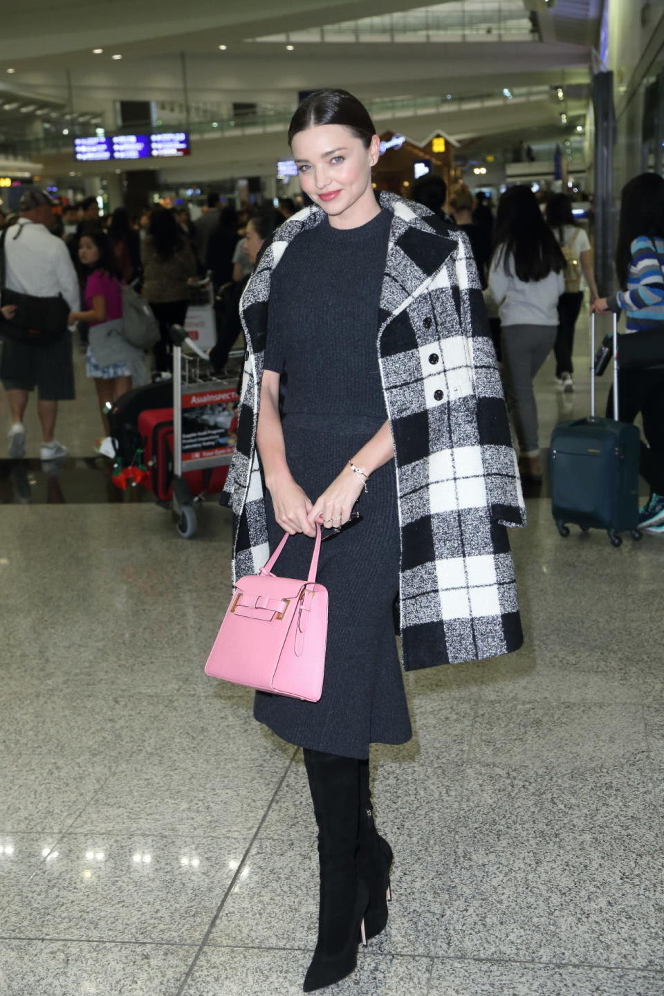 Miranda Kerr touched down in Hong Kong in the perfect fall look on December 9, 2015