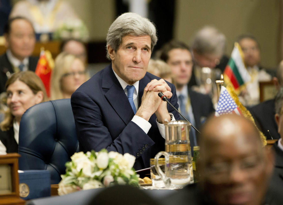 U.S. Secretary of State John Kerry attends the opening session of the Syria Donors' Conference at Bayan Palace Liberation Hall in Kuwait, Wednesday, Jan. 15, 2014. (AP Photo/Pablo Martinez Monsivais, Pool)