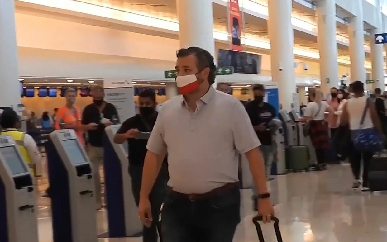 In this image from video, Sen. Ted Cruz, R-Texas, walks to check in for his flight back to the U.S., at Cancun International Airport in Cancun, Mexico, Thursday, Feb. 18, 2021.  - Dan Christian Rojas/AP Photo