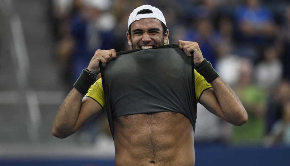 Matteo Berrettini, of Italy, bites his shirt after defeating Andrey Rublev, of Russia, during the fourth round of the US Open tennis championships Monday, Sept. 2, 2019, in New York. (AP Photo/Sarah Stier)