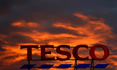 FILE PHOTO: A company logo is pictured outside a Tesco supermarket in Altrincham, England, April 16, 2016. REUTERS/Phil Noble/File Photo