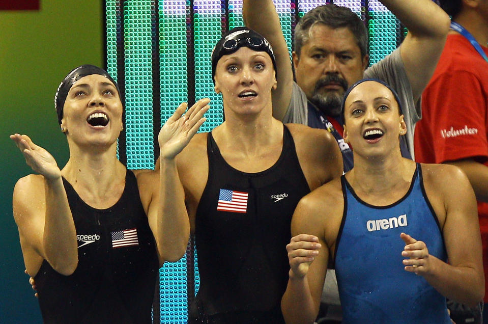 SHANGHAI, CHINA - JULY 30: (L-R) Natalie Coughlin, Dana Vollmer and Rebecca Soni of the United States cheer on Melissa Franklin on the way to winning the gold medal in the Women's 4x100m Medley Relay during Day Fifteen of the 14th FINA World Championships at the Oriental Sports Center on July 30, 2011 in Shanghai, China. (Photo by Quinn Rooney/Getty Images)